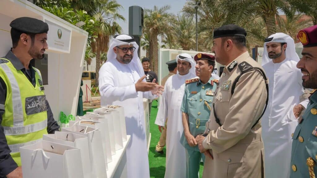 Commander of Sharjah Police listens to the Director of Rafid Traffic Solutions presenting Rafid’s smart traffic services during Unified Gulf Traffic Week 2025 at City Centre Al Zahia