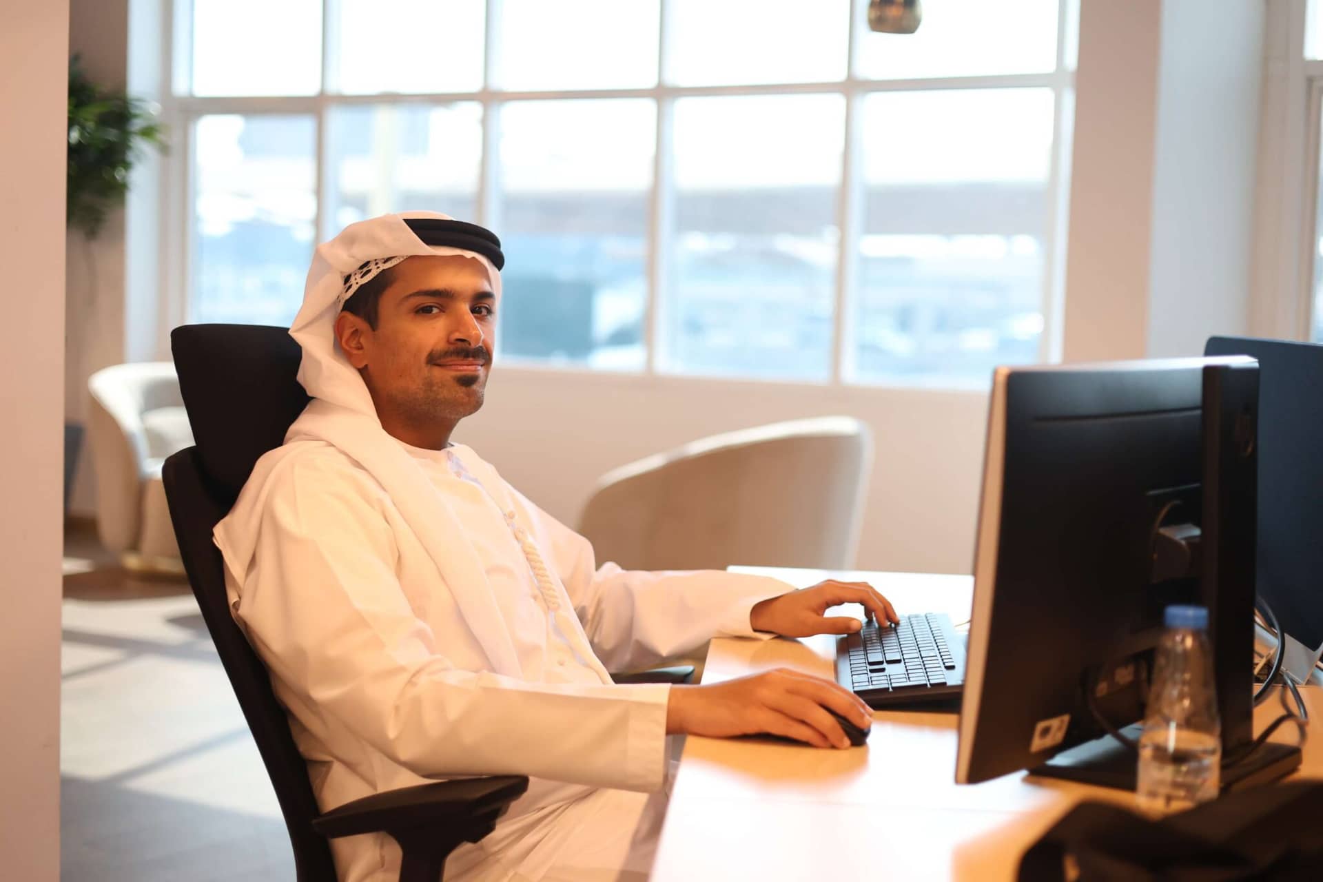 Team member working at Rafid Automotive Solutions headquarters in Sharjah